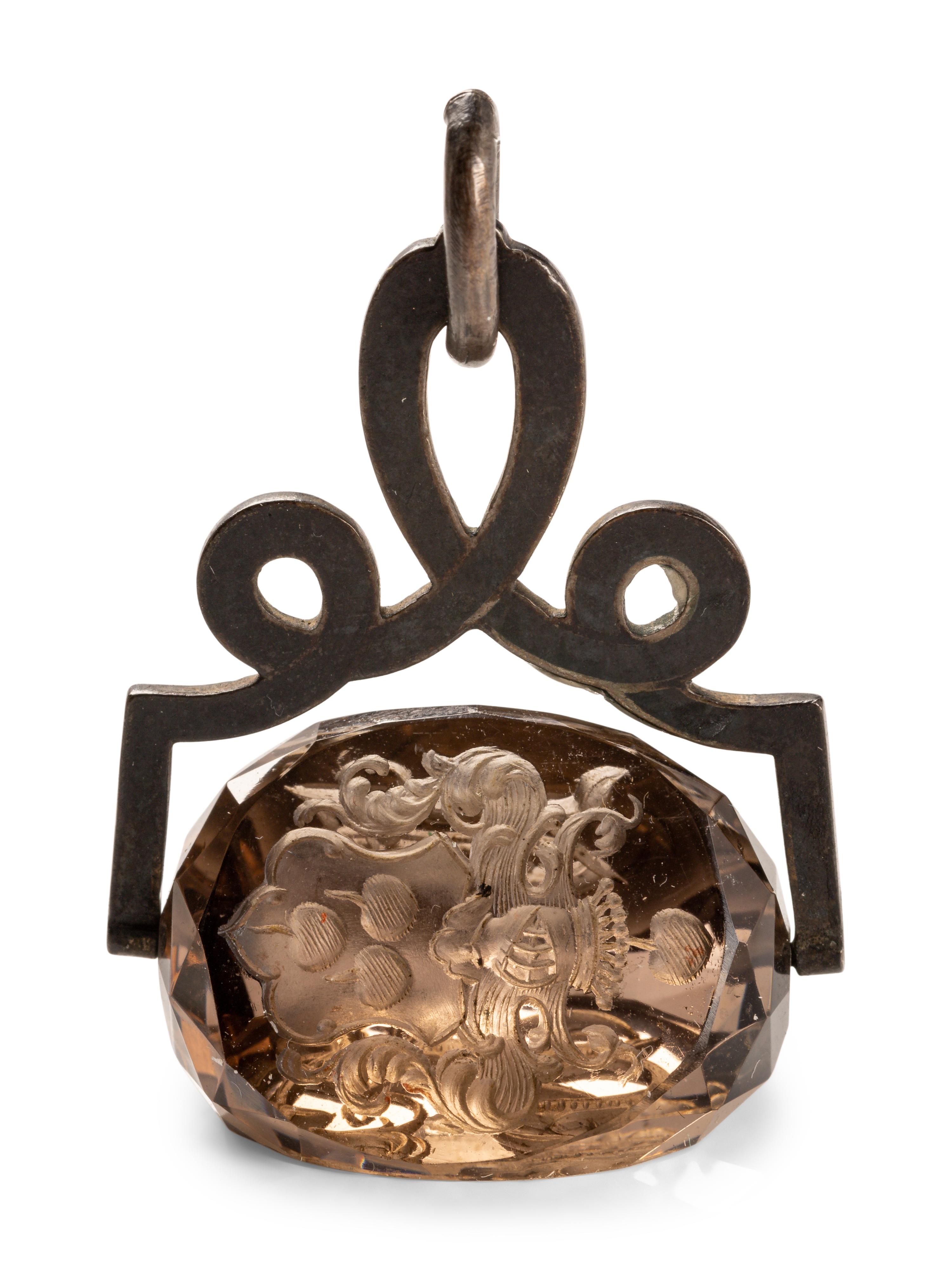 A German Carved Topaz and Gilt Metal Mounted Hand Seal