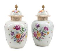 A Pair of Continental Gilt Bronze Mounted Porcelain Jars