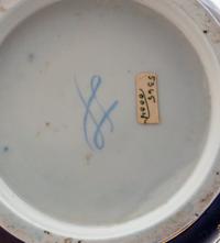 A Pair of Sèvres Style Painted and Parcel Gilt Porcelain Cache Pots