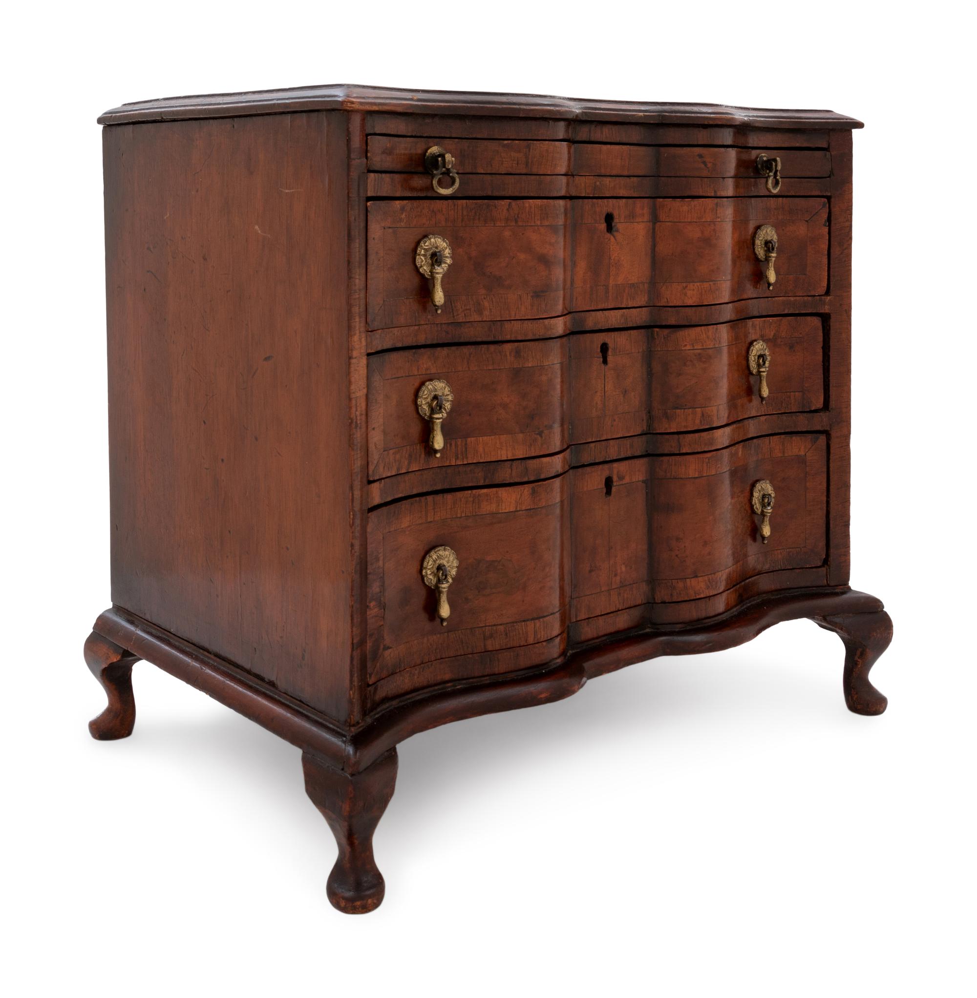 A Continental Walnut Diminutive Chest of Drawers or Salesman's Model
