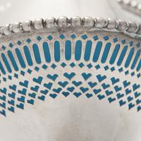 An Engraved and Pierced Coin Silver Glass-Lined Sugar Basket
