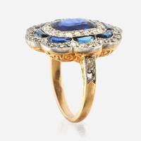 A sapphire, diamond, and platinum topped gold ring