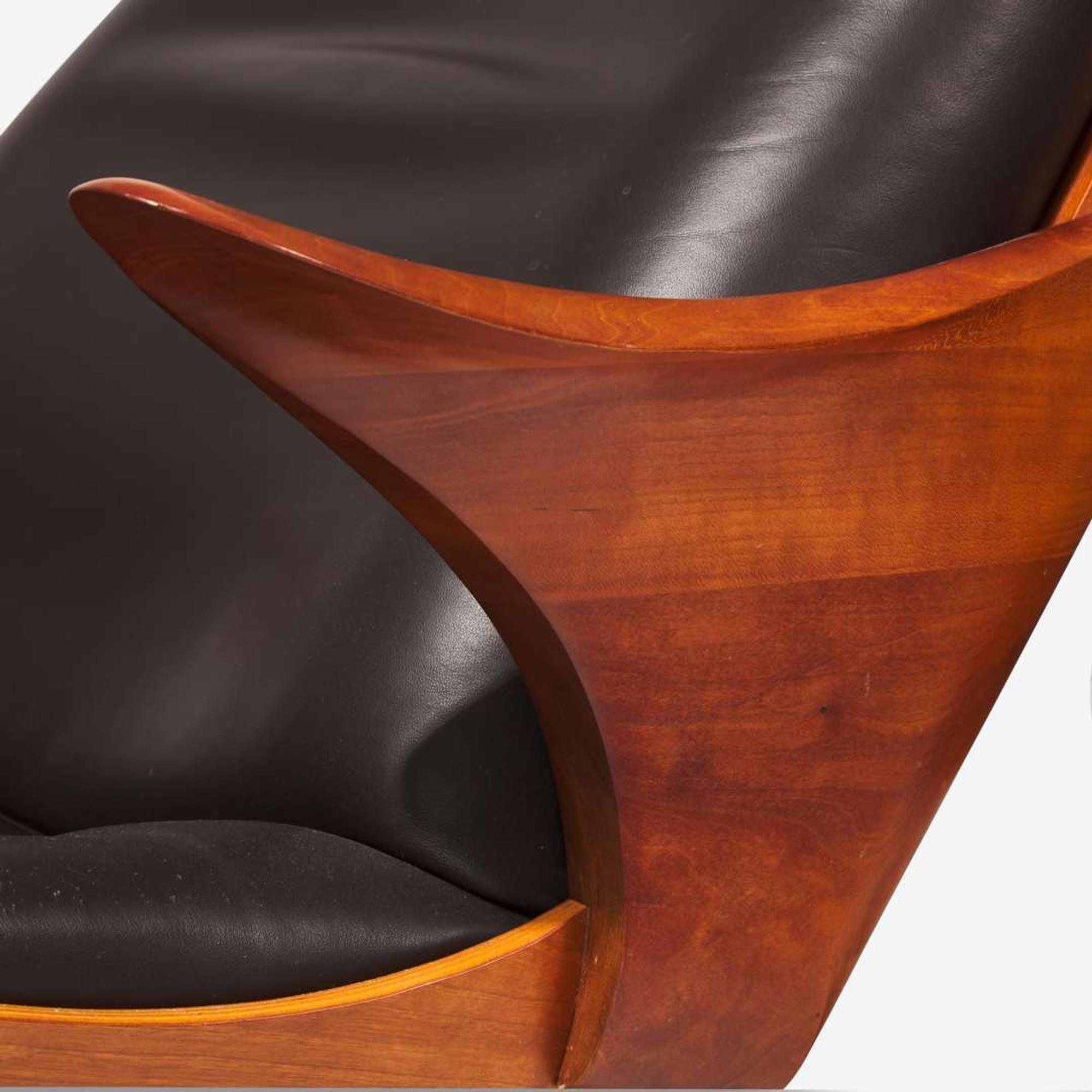 Thomas Moser Cabinetmakers (American, active 1972-Present) "Kinesis" Swivel Lounge Chair and Ottoman, USA, 2010