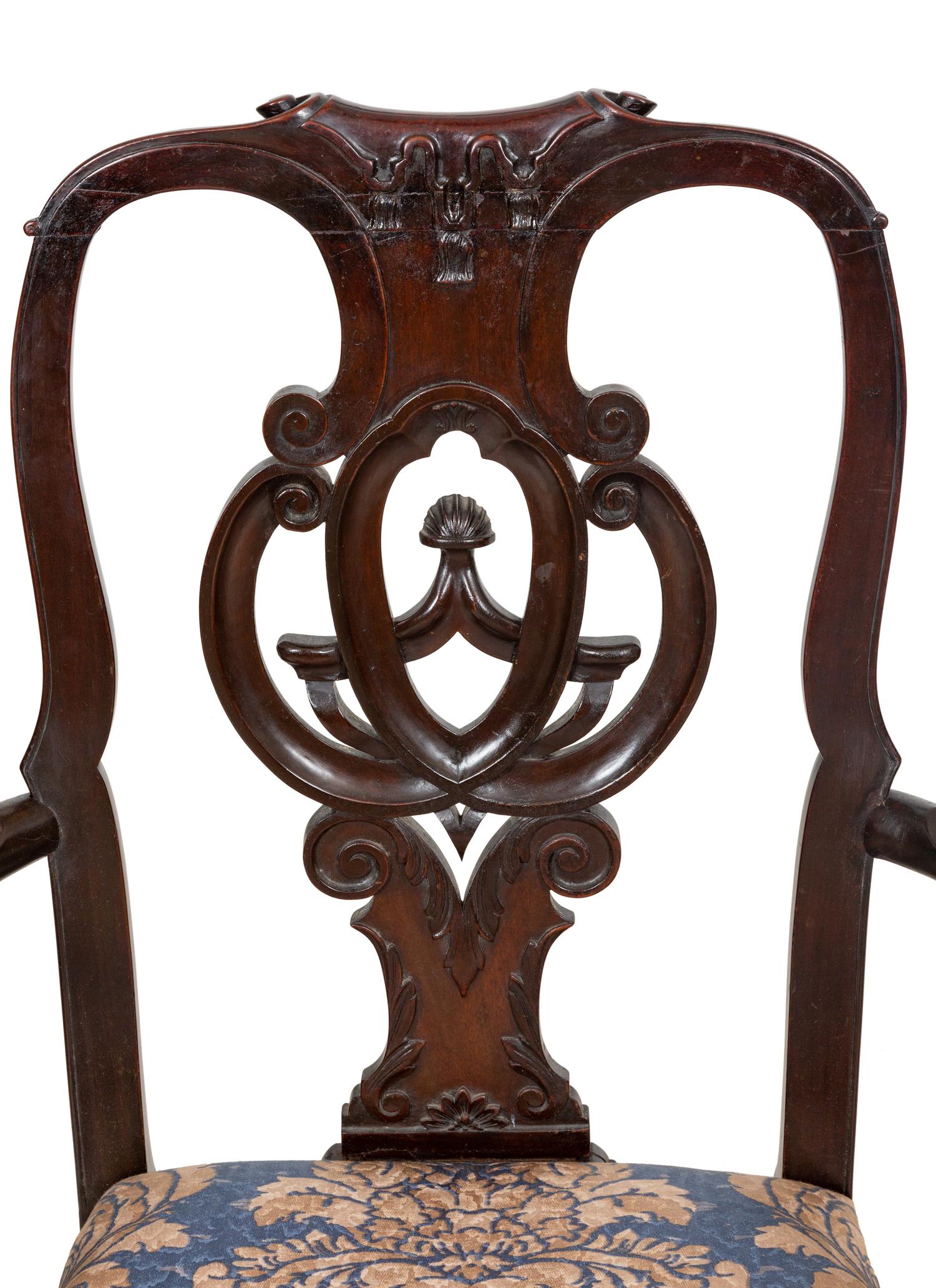 A Set of Twelve Continental Walnut Dining Chairs