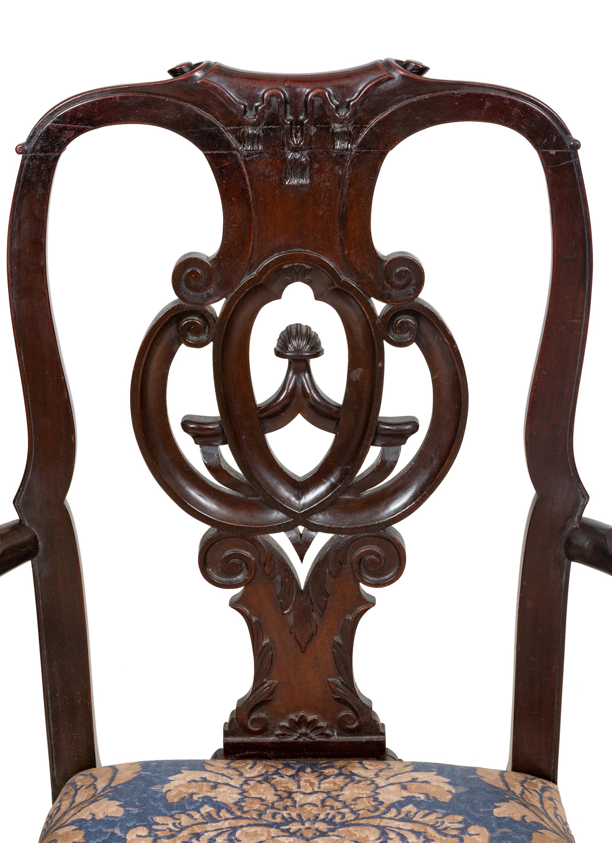 A Set of Twelve Continental Walnut Dining Chairs
