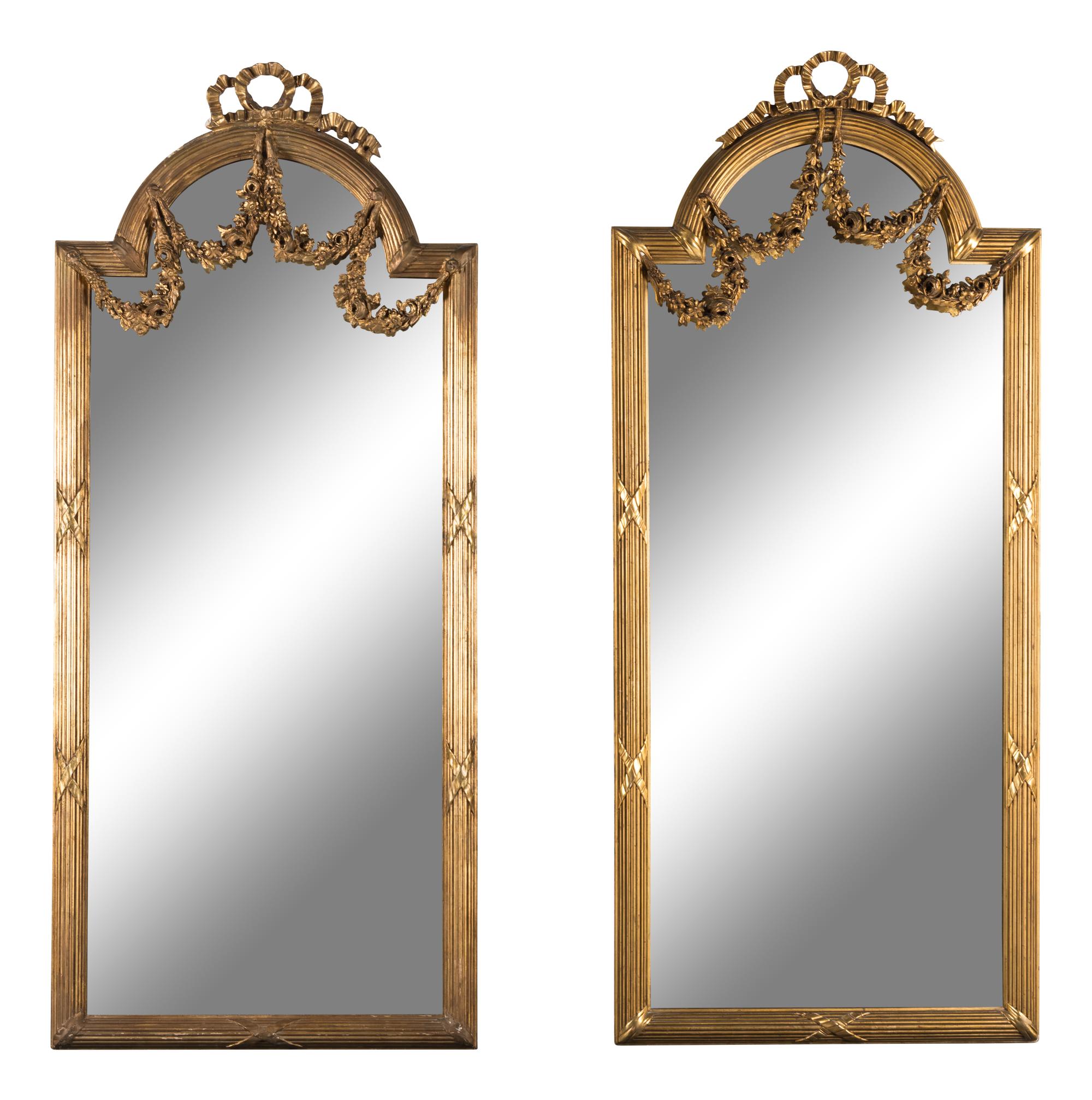 A Pair of Louis XVI Style Carved Giltwood Pier Mirrors