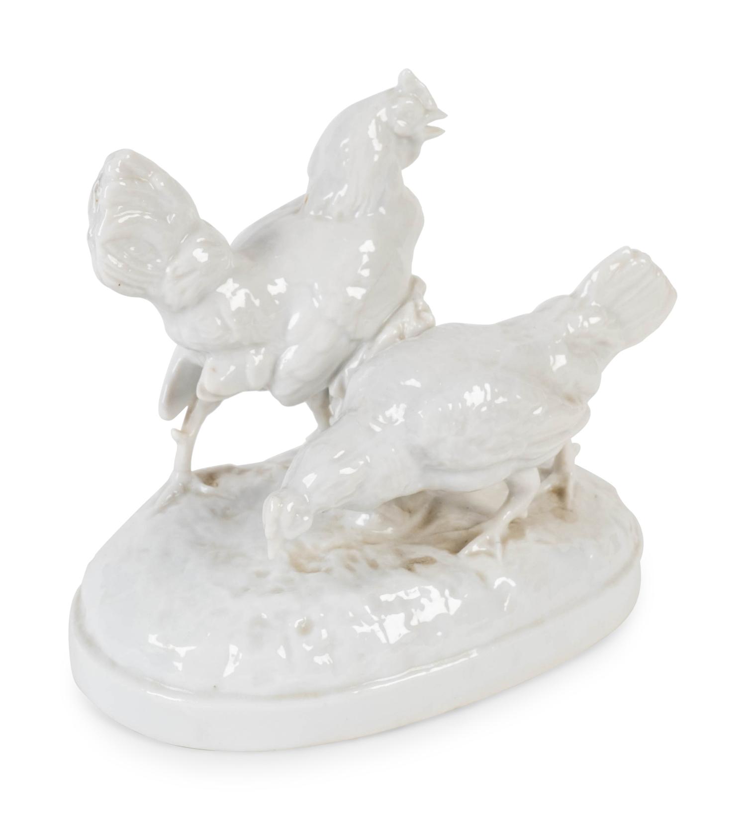 A German Blanc de Chine Porcelain Figure of Two Chickens