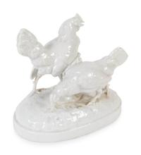 A German Blanc de Chine Porcelain Figure of Two Chickens