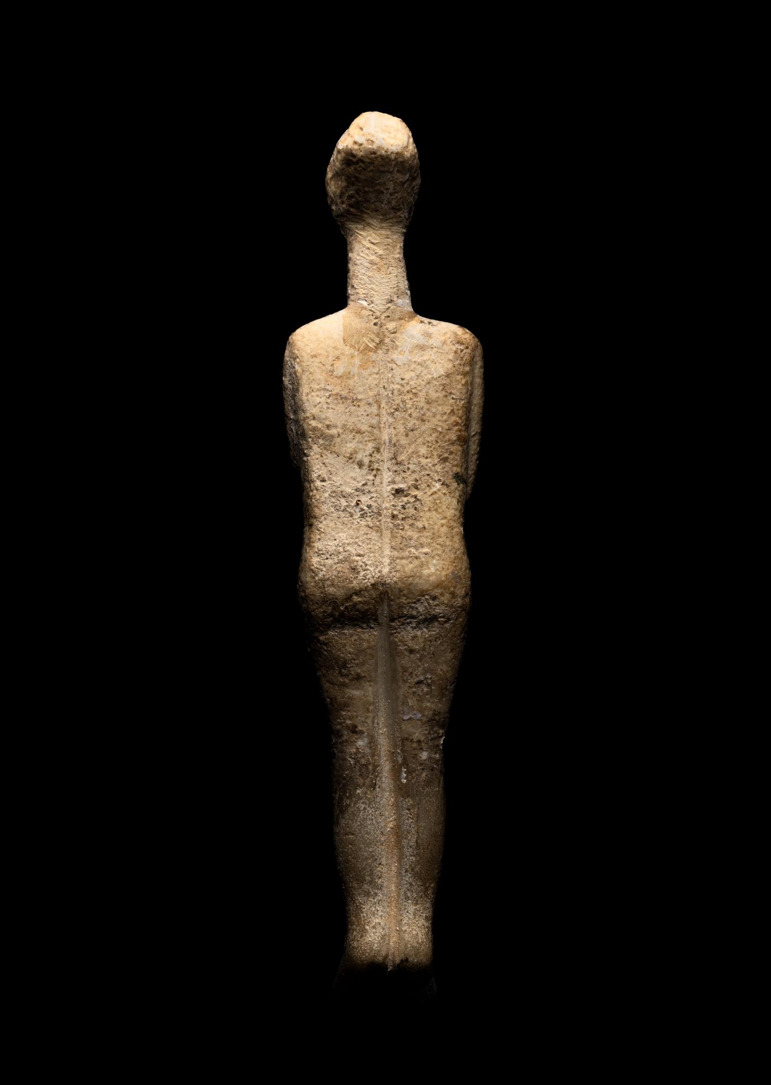 A Cycladic Marble Reclining Female Figure