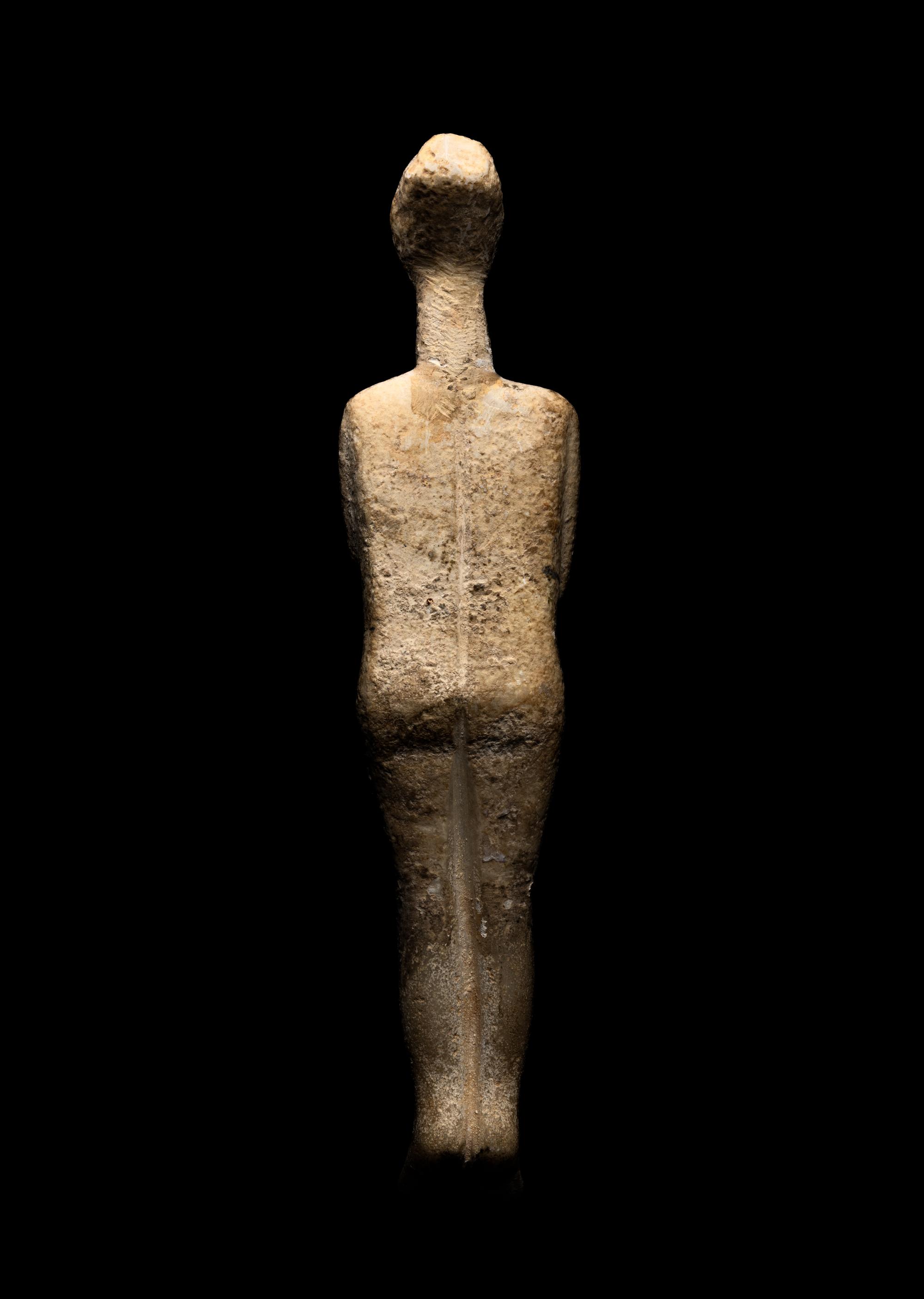 A Cycladic Marble Reclining Female Figure