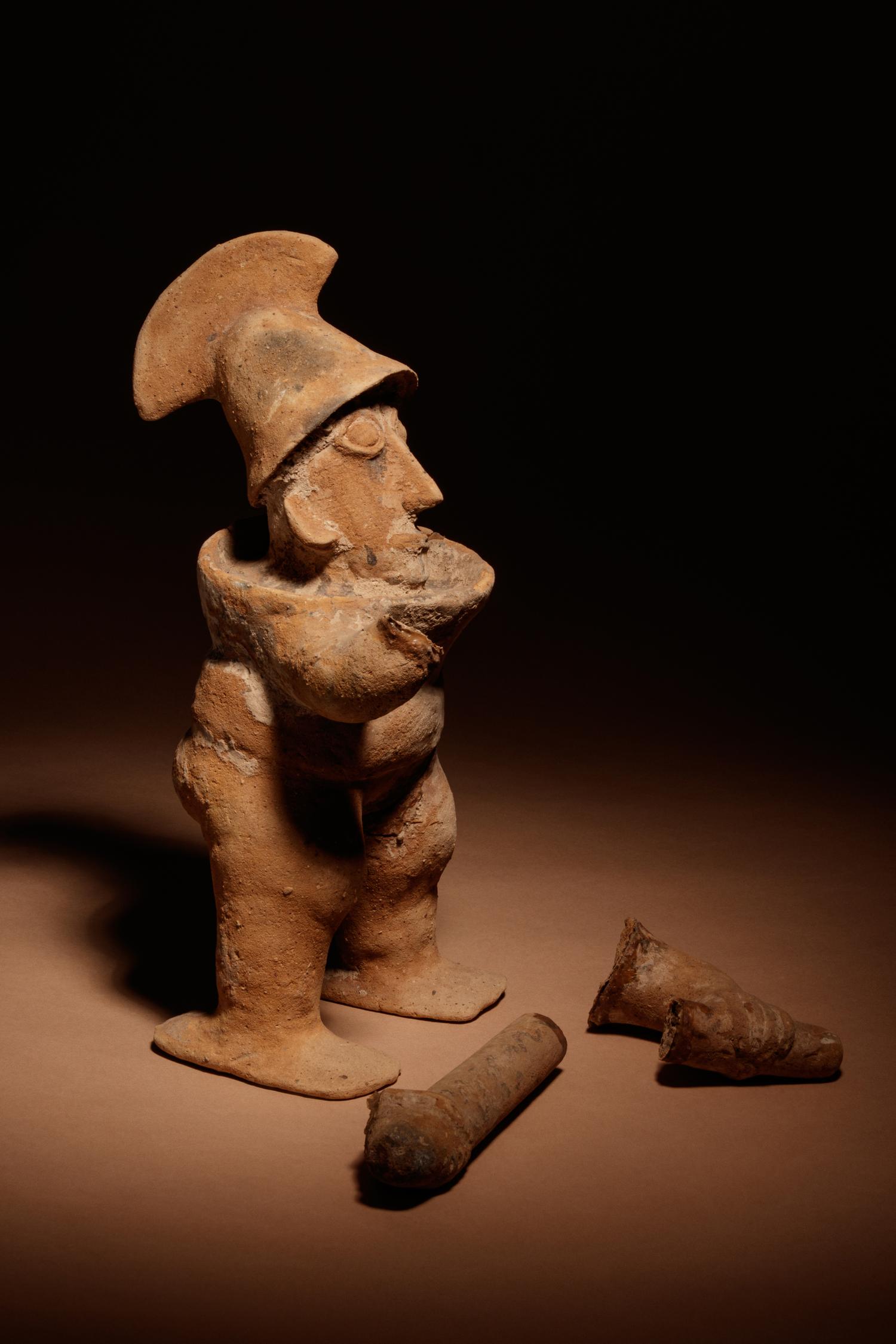 A Nayarit Terracotta Warrior Figure, with Associated Head and Foot