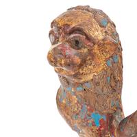 A Pair of Parcel-Gilt and Polychrome Decorated Lion-Form Crest Supporters