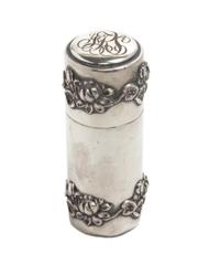 A Silver Cylindrical Box, , the lid with a script monogram, the body applied with bands of lotus at the top and bottom.