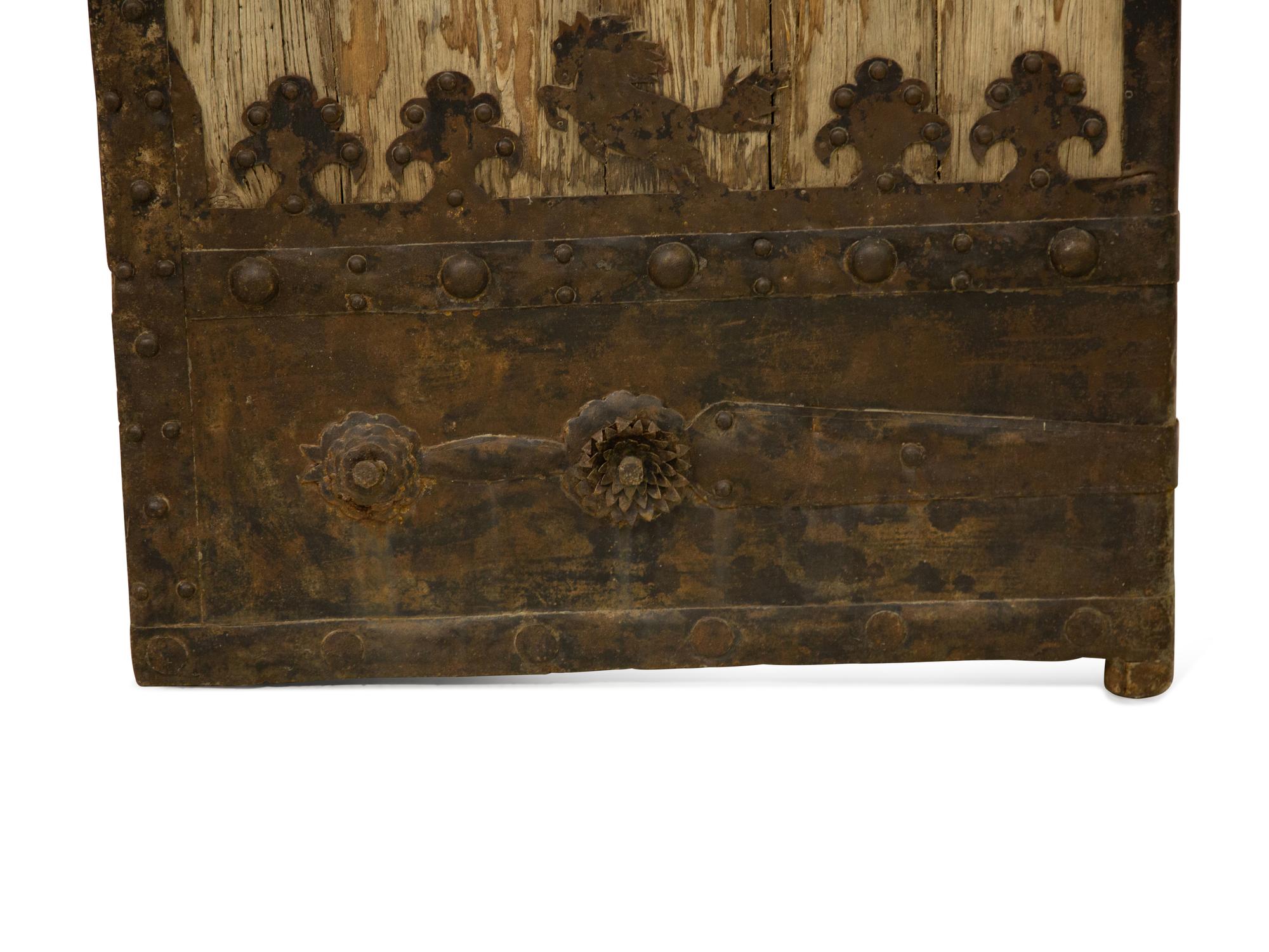 A Pair of Continental Iron Mounted Weathered Oak Doors — 19th Century