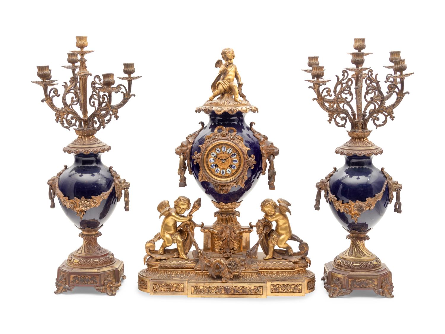 A French Gilt Bronze and Porcelain Clock Garniture