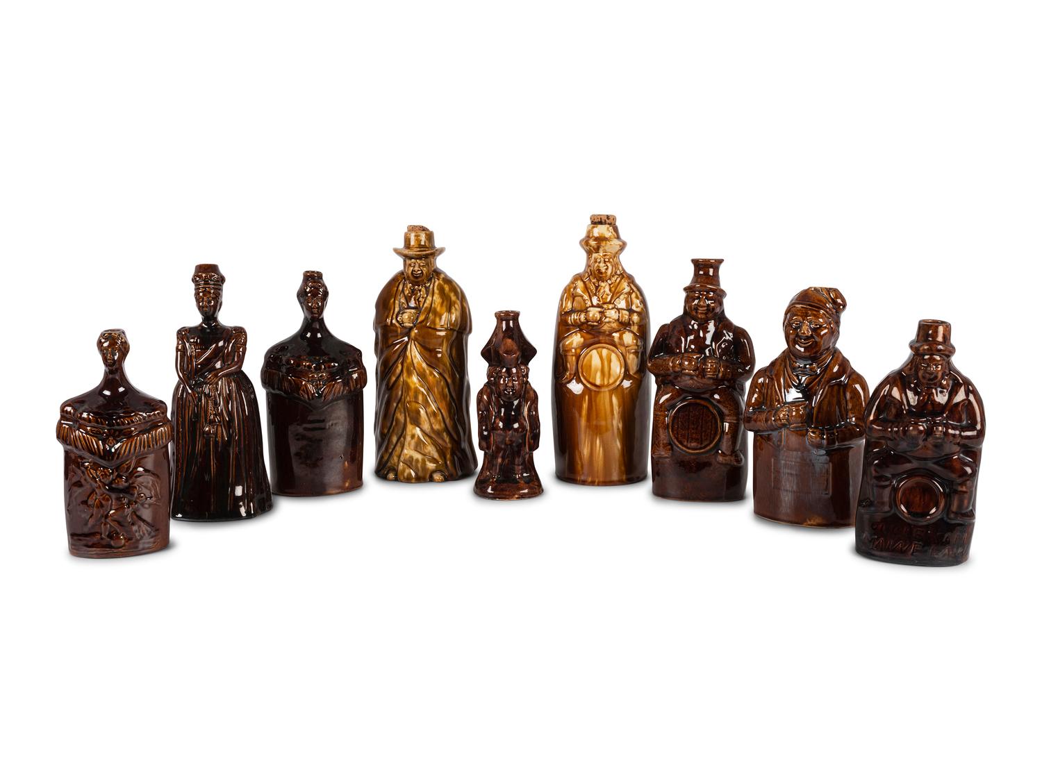 Nine Figural Flasks in Brown Glaze