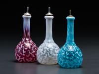 Three Coral Opalescent Glass Barber Bottles