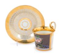 A Vienna Painted and Parcel Gilt Porcelain Teacup and Saucer