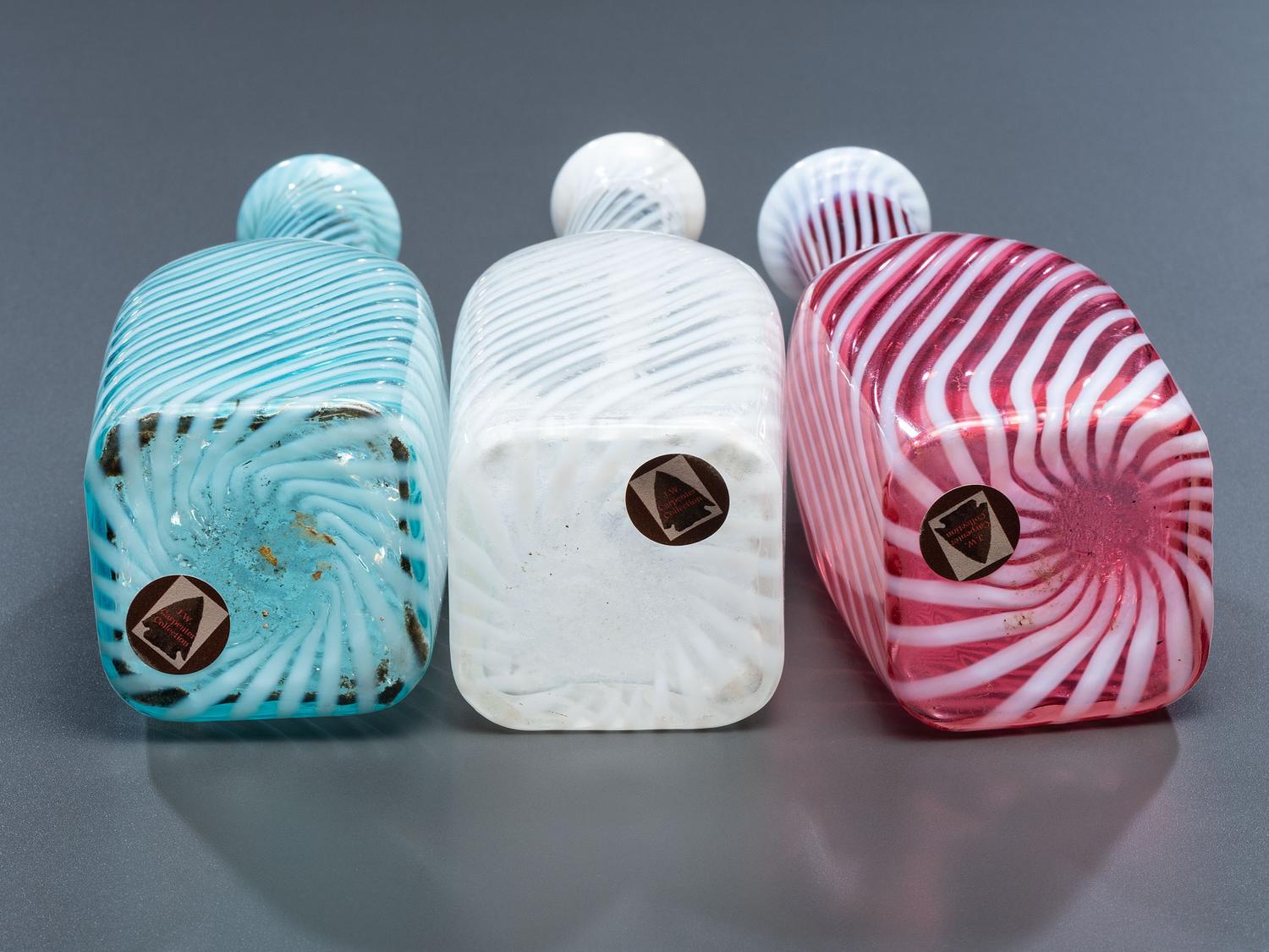 Three Swirl Opalescent Glass Barber Bottles