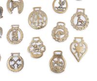 A Collection of Twenty Five Pressed and Cast Brass Buckles