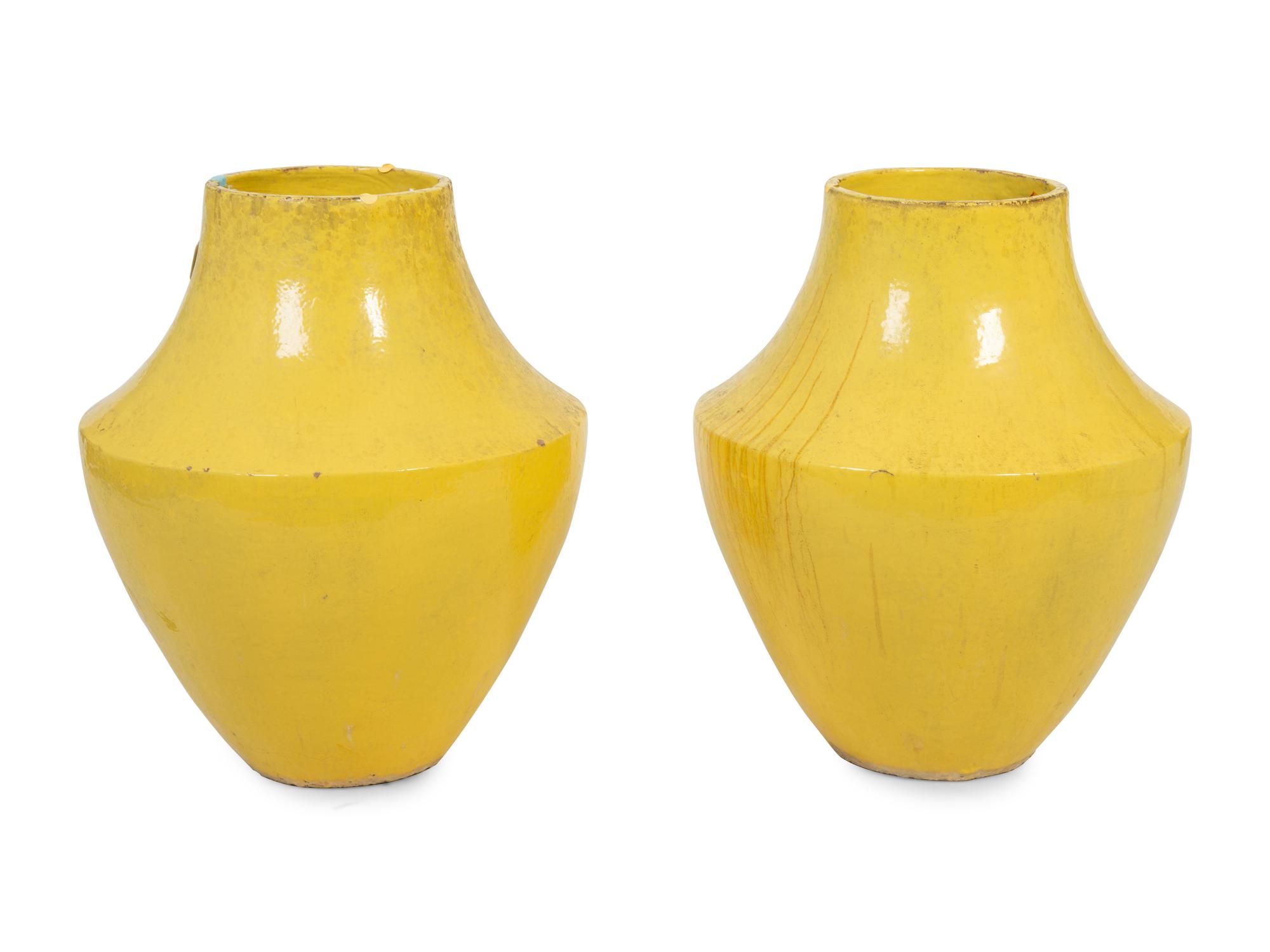 A Pair of Large Yellow-Glazed Pottery Jars