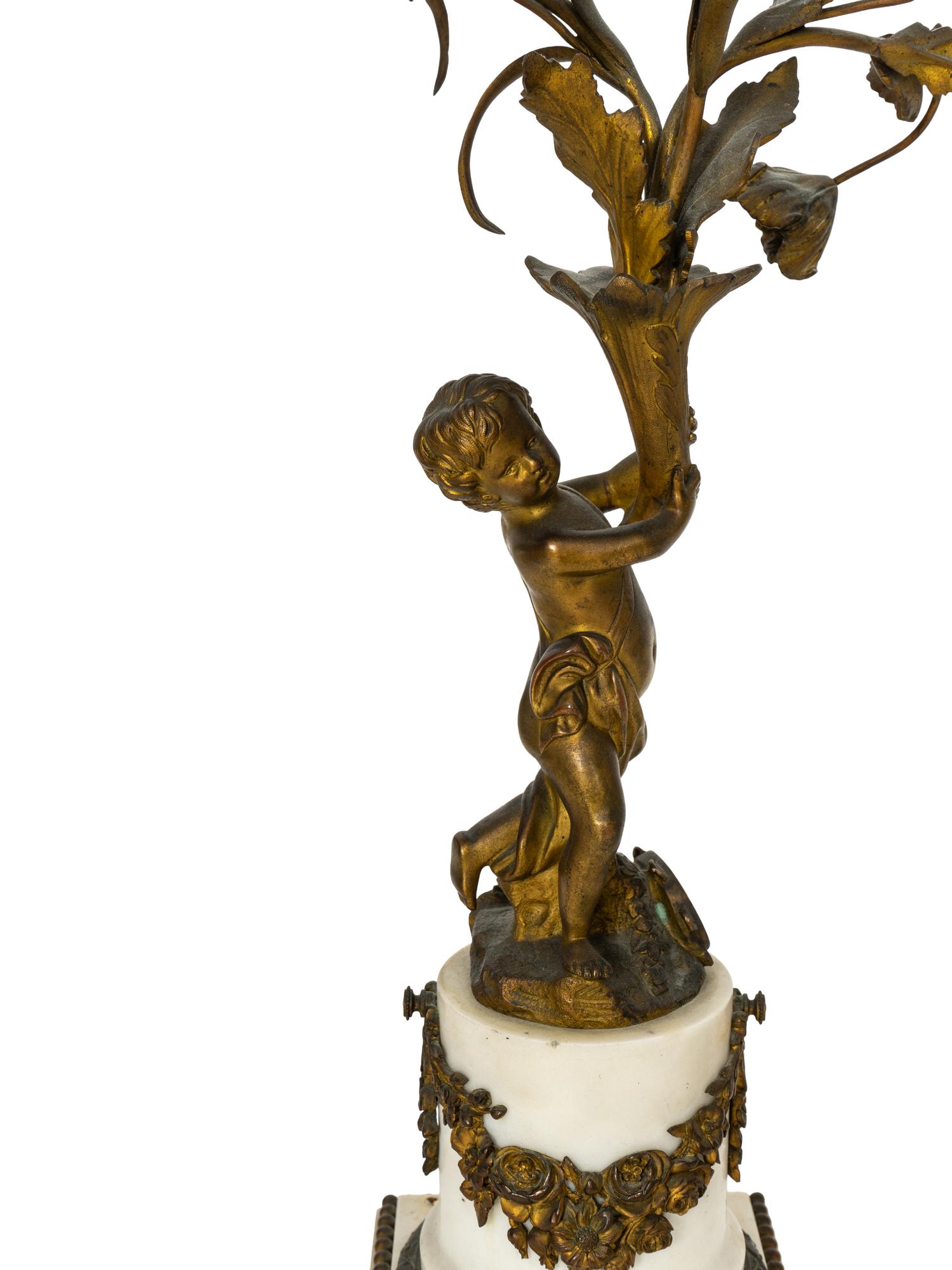 A Pair of French Gilt Bronze and Alabaster Three-Light Candelabra