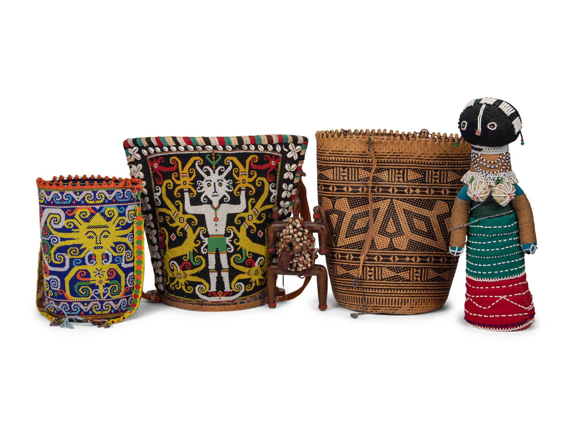 A Ndebele Doll, Two Dayak Baskets and Baby Carrier, and a Carved and Beaded Namji Doll
