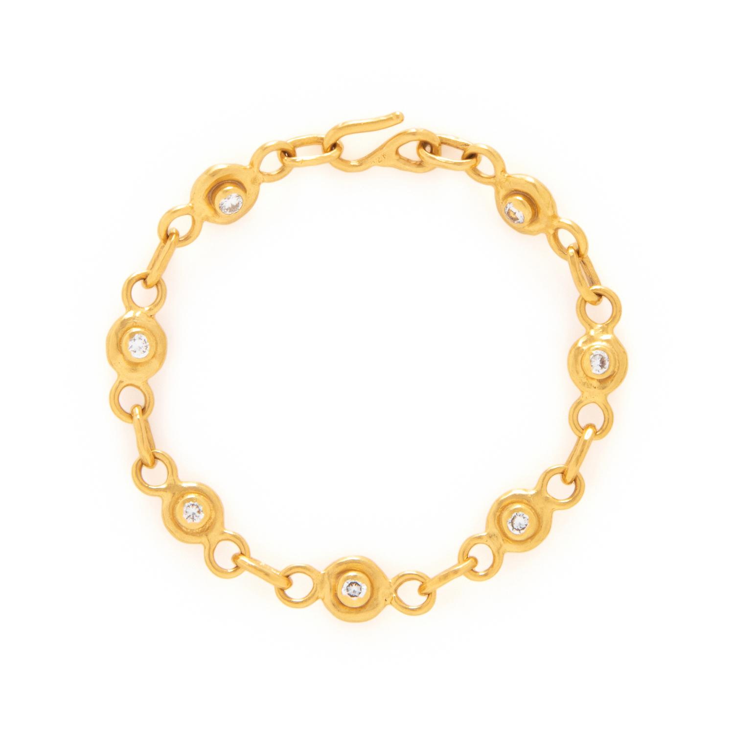 JEAN MAHIE, DIAMOND, SAPPHIRE, AND HIGH KARAT GOLD BRACELET