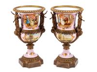 A Pair of Sèvres Style Gilt Bronze Mounted Porcelain Urns