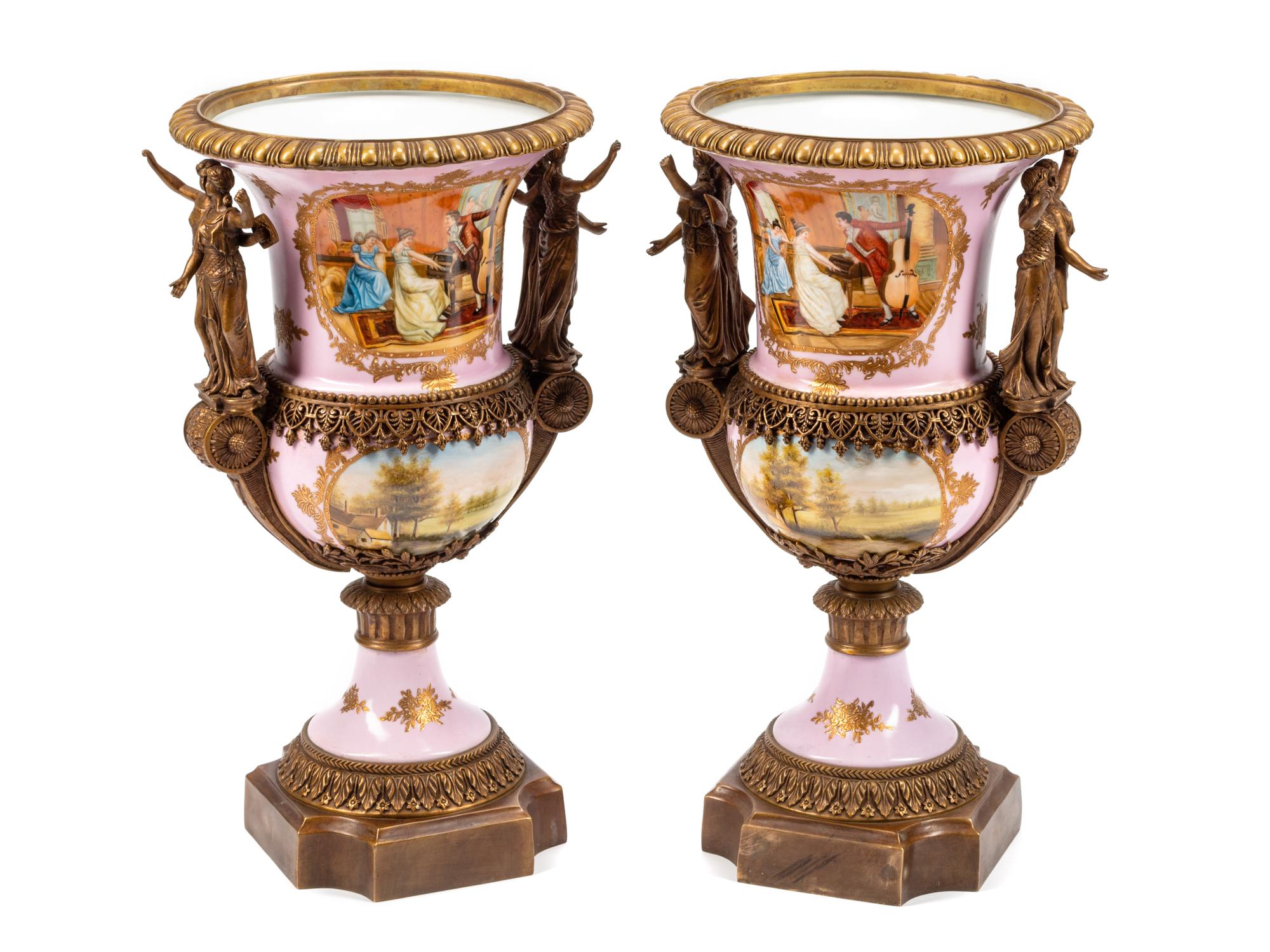 A Pair of Sèvres Style Gilt Bronze Mounted Porcelain Urns