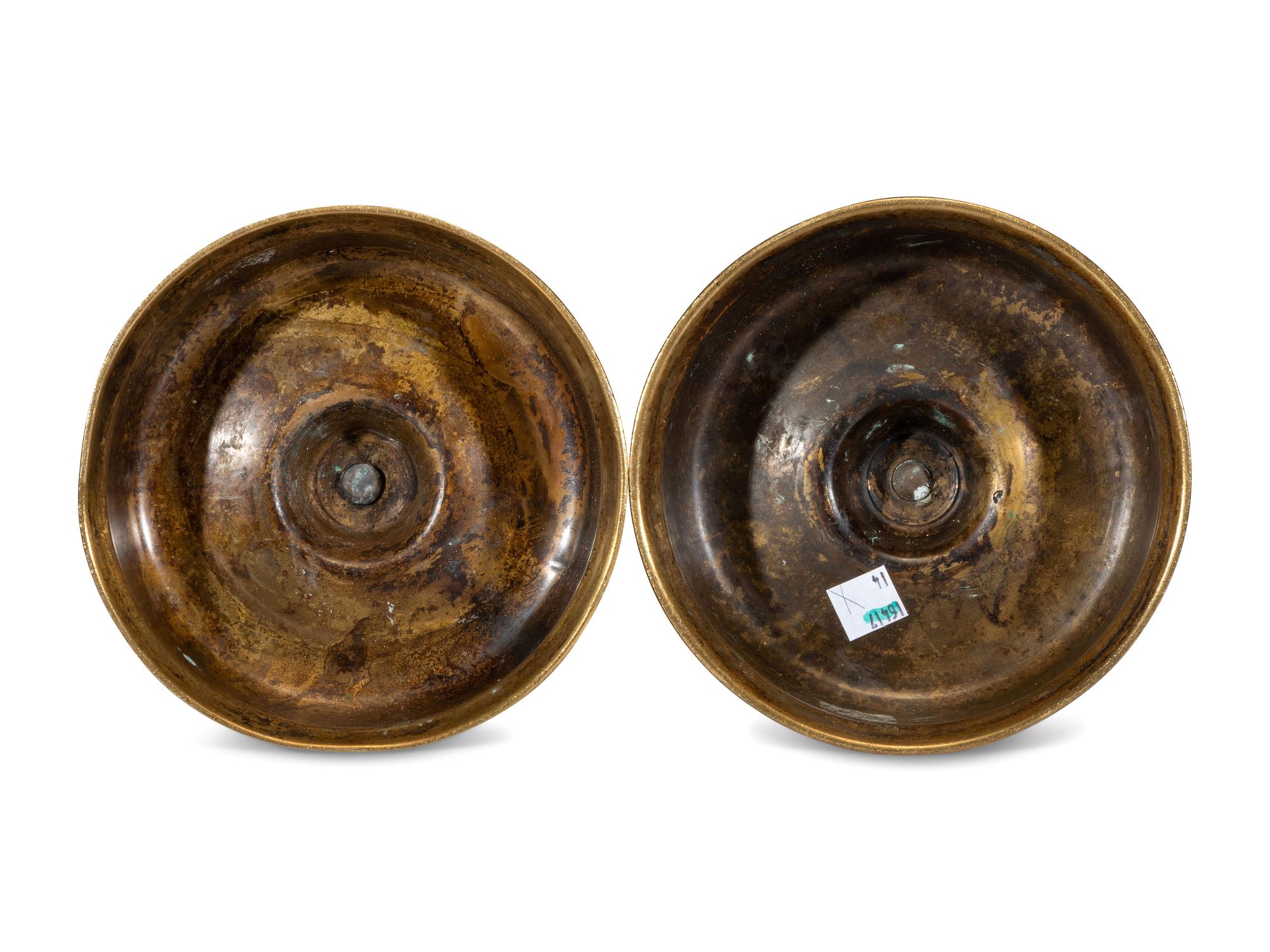 A Pair of Continental Brass Candlesticks