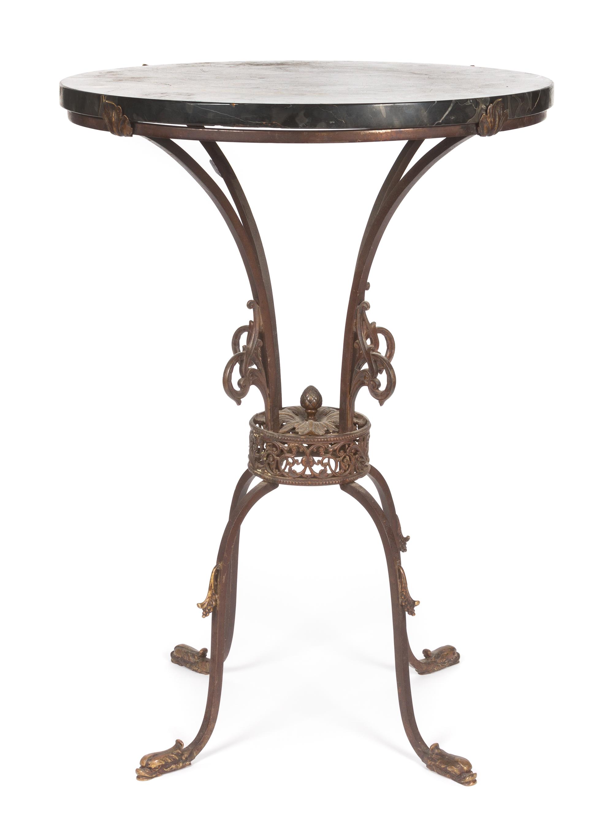 A Neoclassical Iron and Marble Occasional Table Height 28 x diameter 20 inches.