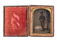 [CIVIL WAR]. Quarter plate tintype of triple-armed Union cavalryman. N.p.: n.p., [1860s].