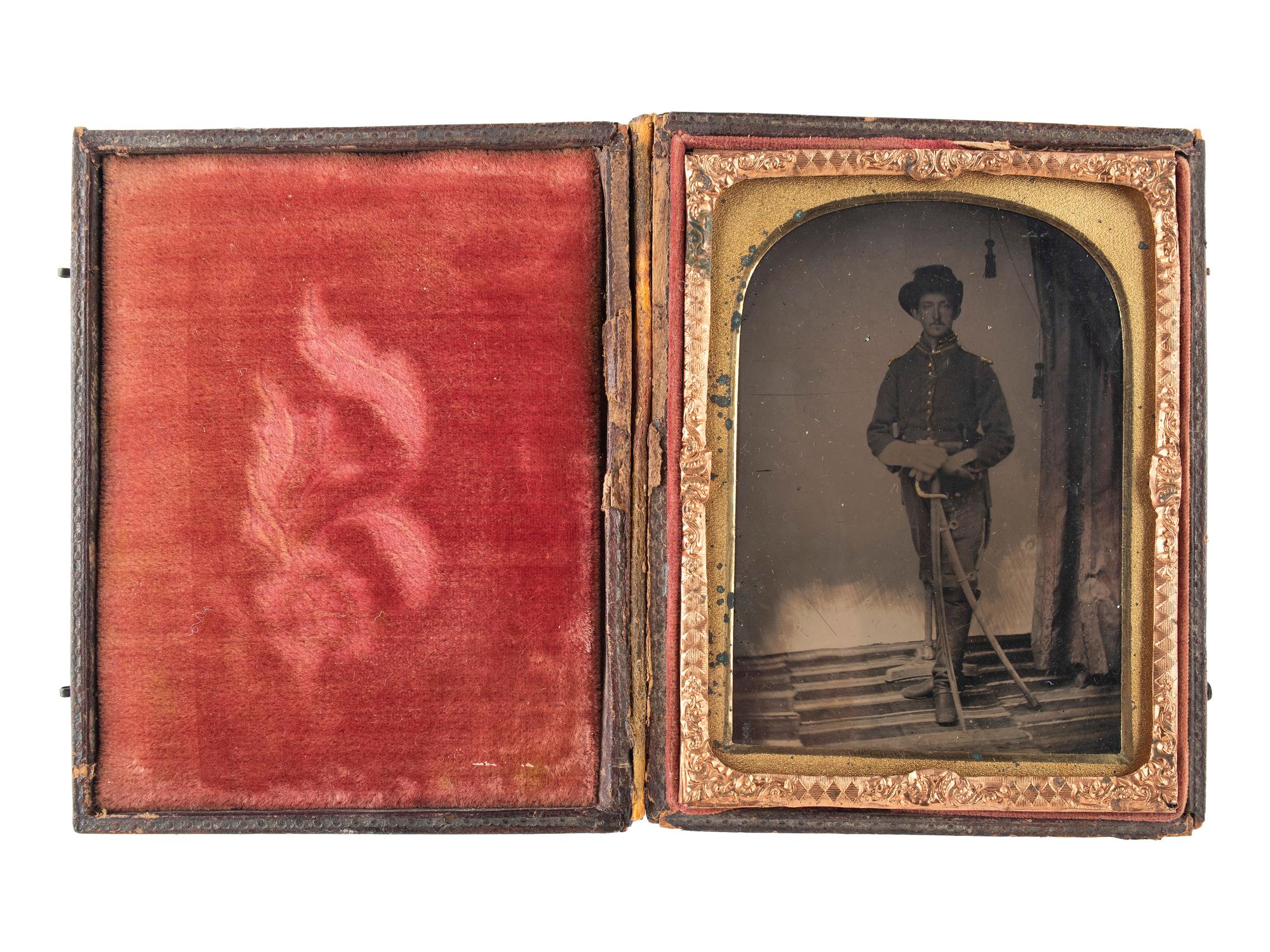 [CIVIL WAR]. Quarter plate tintype of triple-armed Union cavalryman. N.p.: n.p., [1860s].
