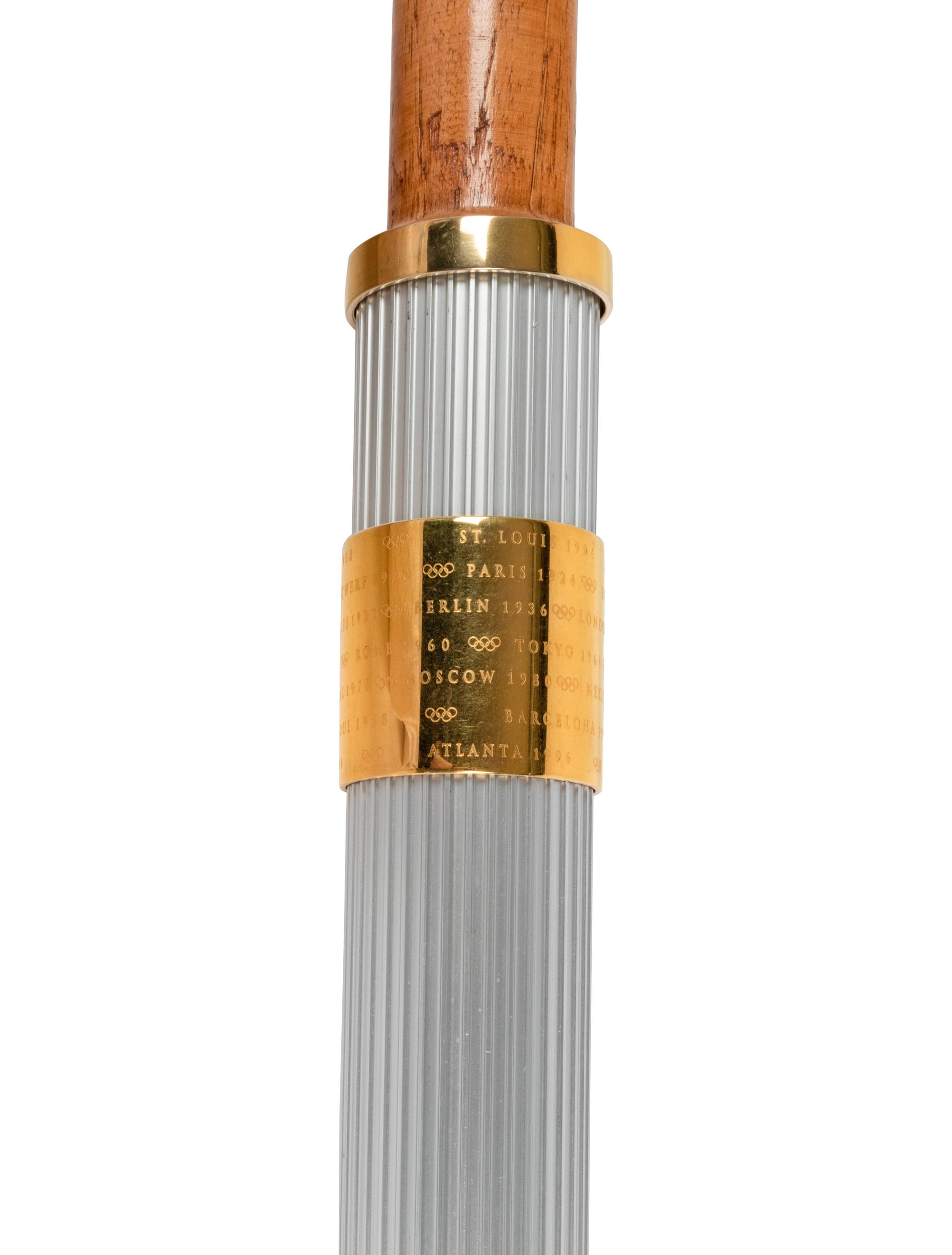 A 1996 Atlanta Olympics Torch and Assorted Relay Used Items by 1964 United States Basketball Team Gold Medal Winner George Wilson,
