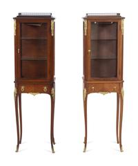 A Near Pair of Louis XV Style Gilt Bronze Mounted Vitrine Cabinets