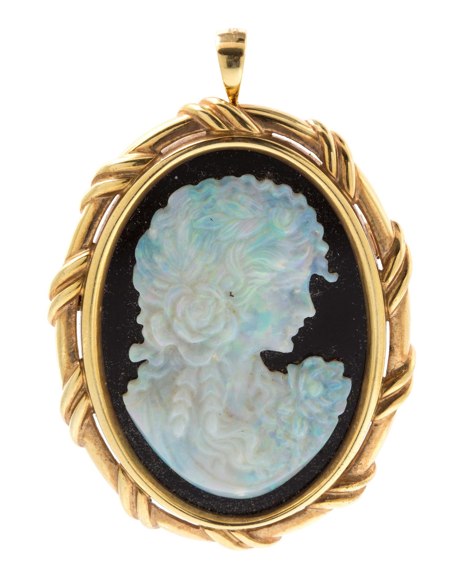 A 14 Karat Yellow Gold, Opal and Onyx Cameo Pendant/Brooch, 10.20 dwts.