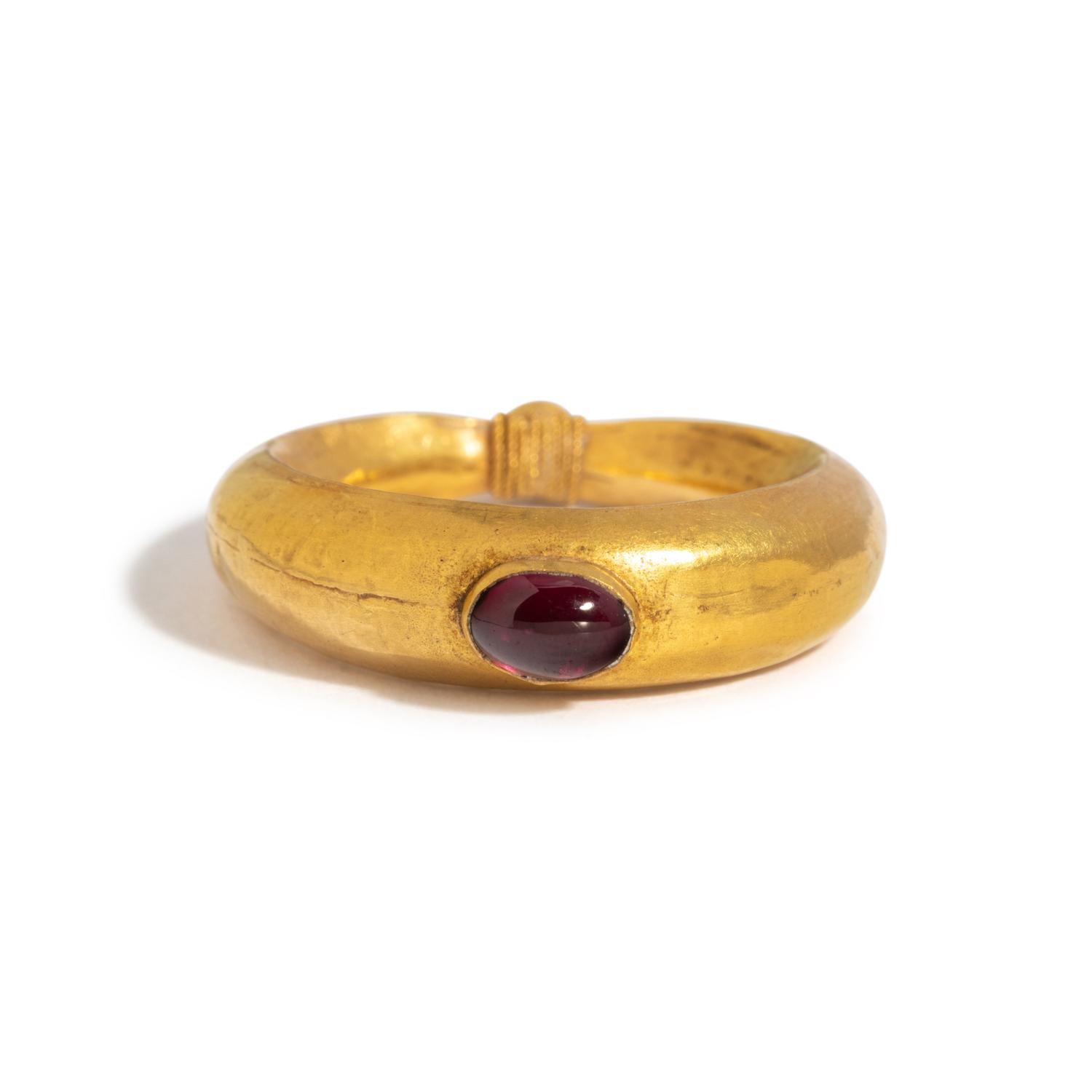A Roman Gold and Garnet Cabochon Finger Ring