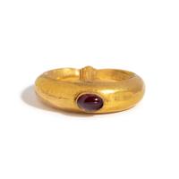 A Roman Gold and Garnet Cabochon Finger Ring