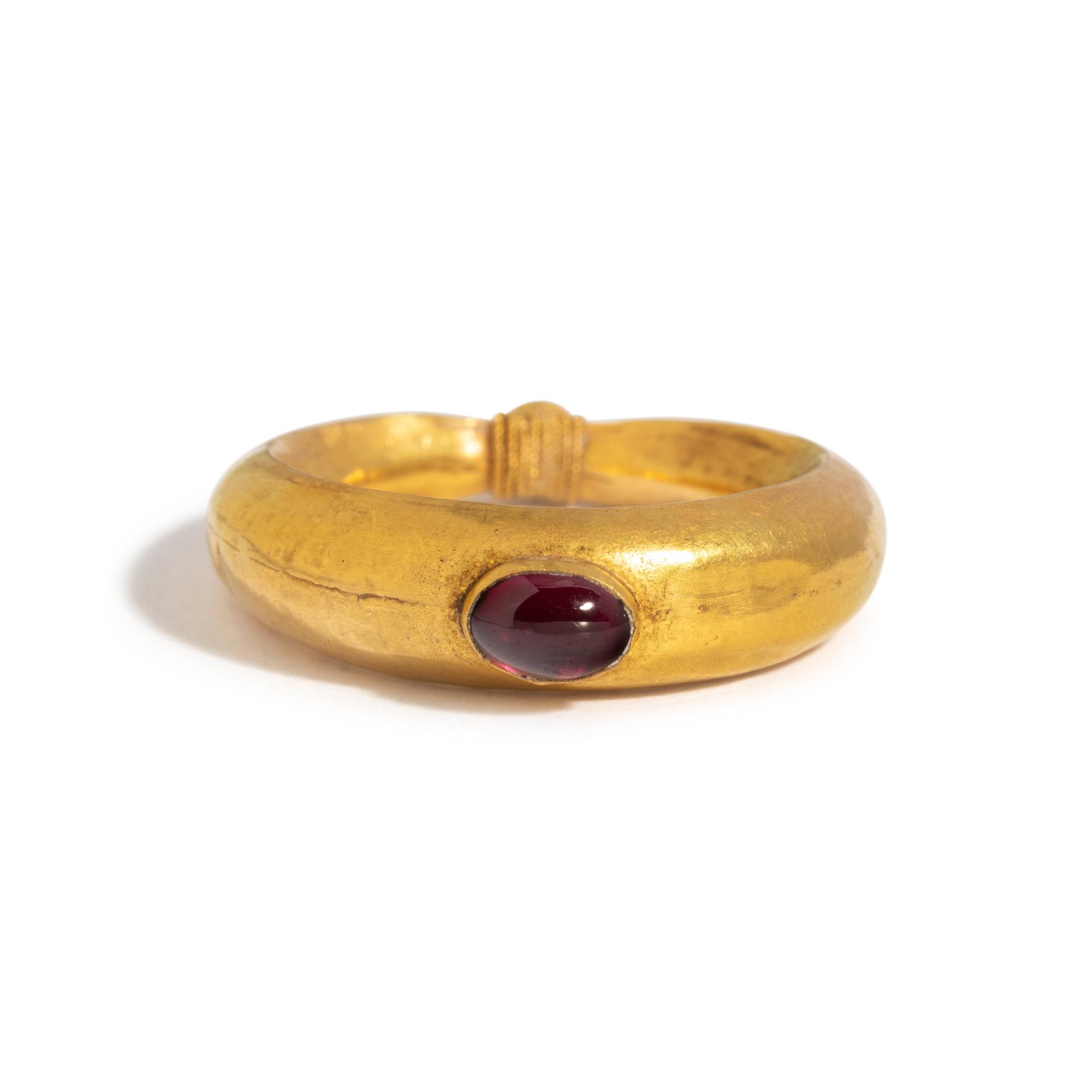 A Roman Gold and Garnet Cabochon Finger Ring