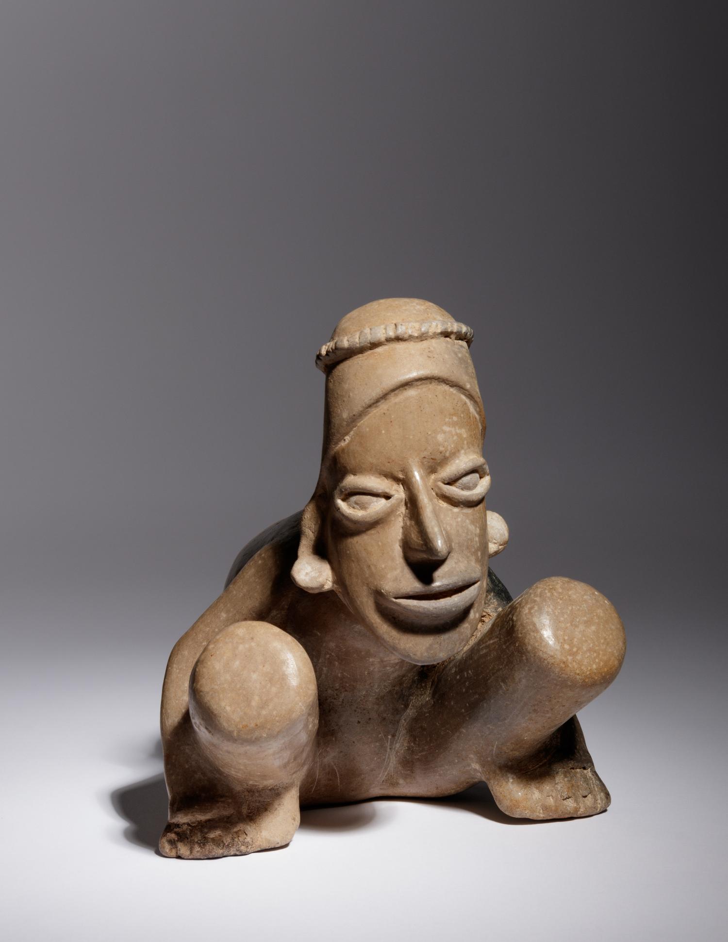 A Jalisco Pottery Crouching Figure