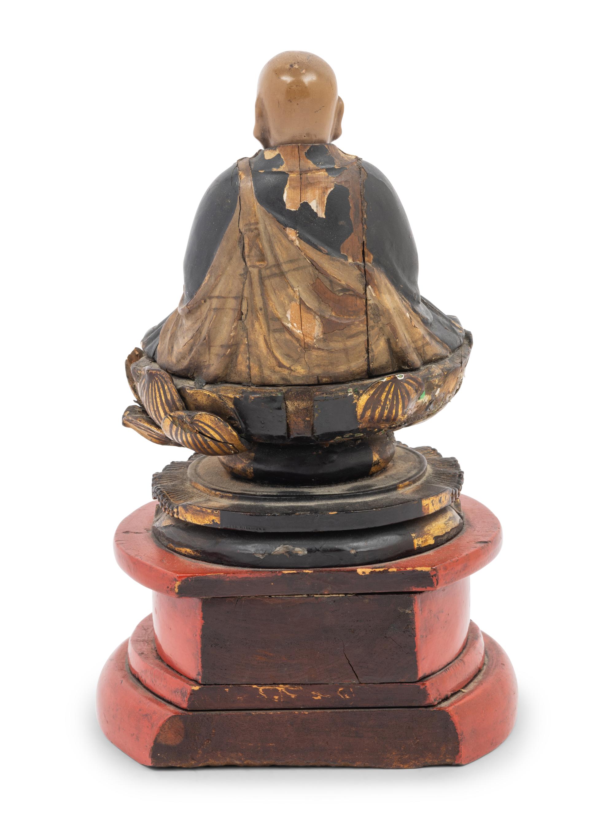A Japanese Lacquered Wood Figure of a Seated Monk