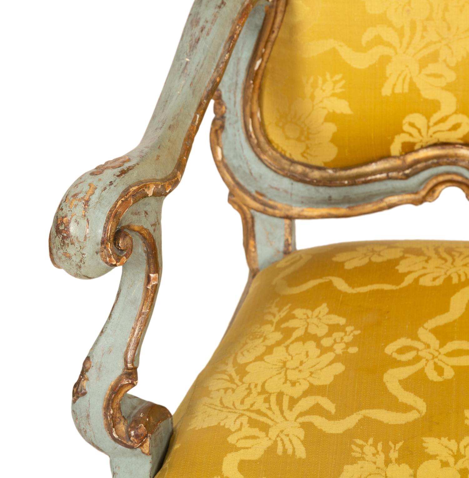 An Italian Rococo Painted and Parcel Gilt Open Armchair