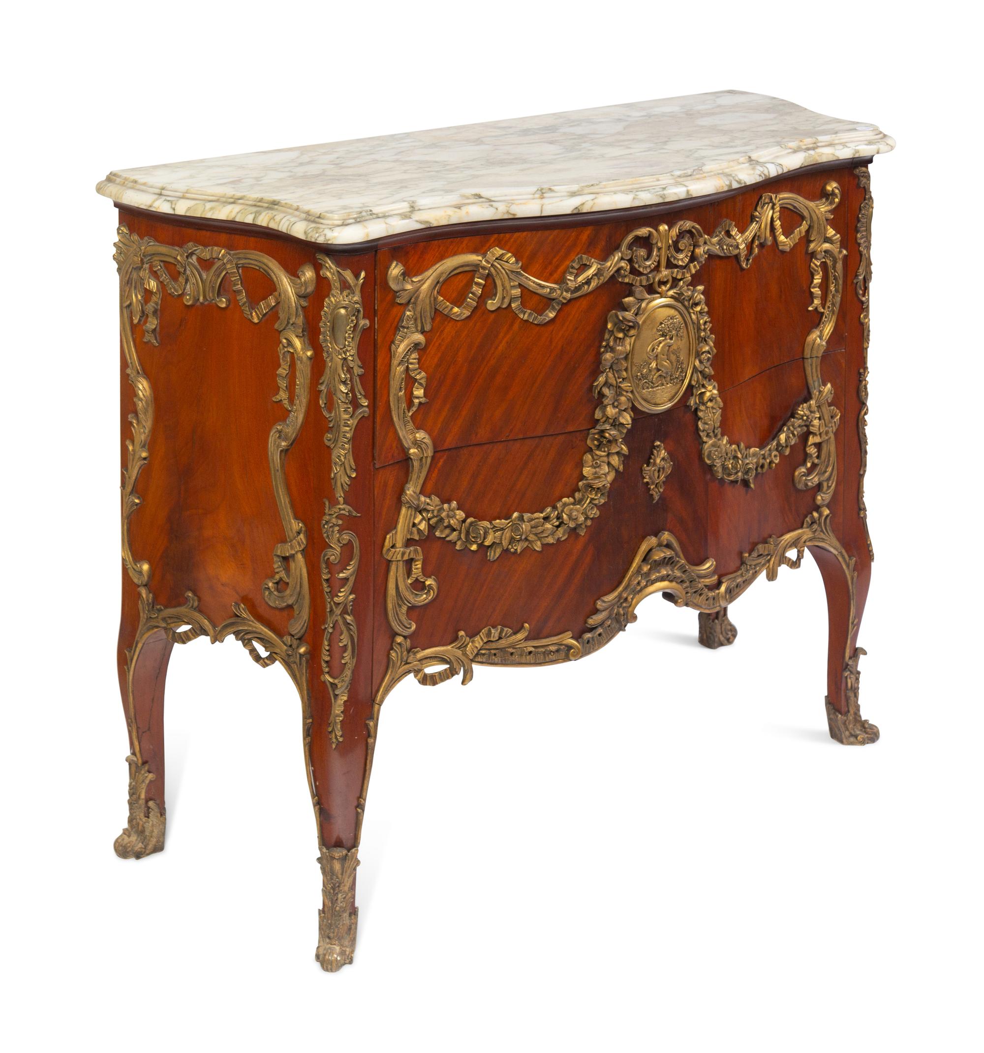 A Louis XV Style Gilt Metal Mounted Figured Walnut Commode