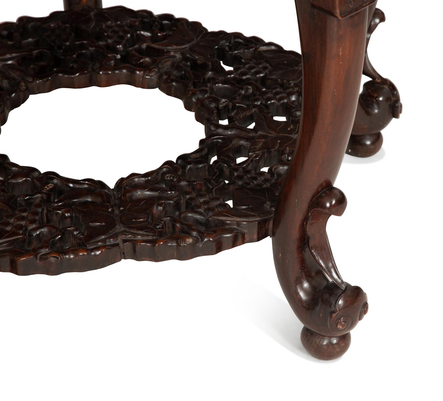 A Chinese Carved Hardwood Center Table and Four Matching Low Stools/Pedestals