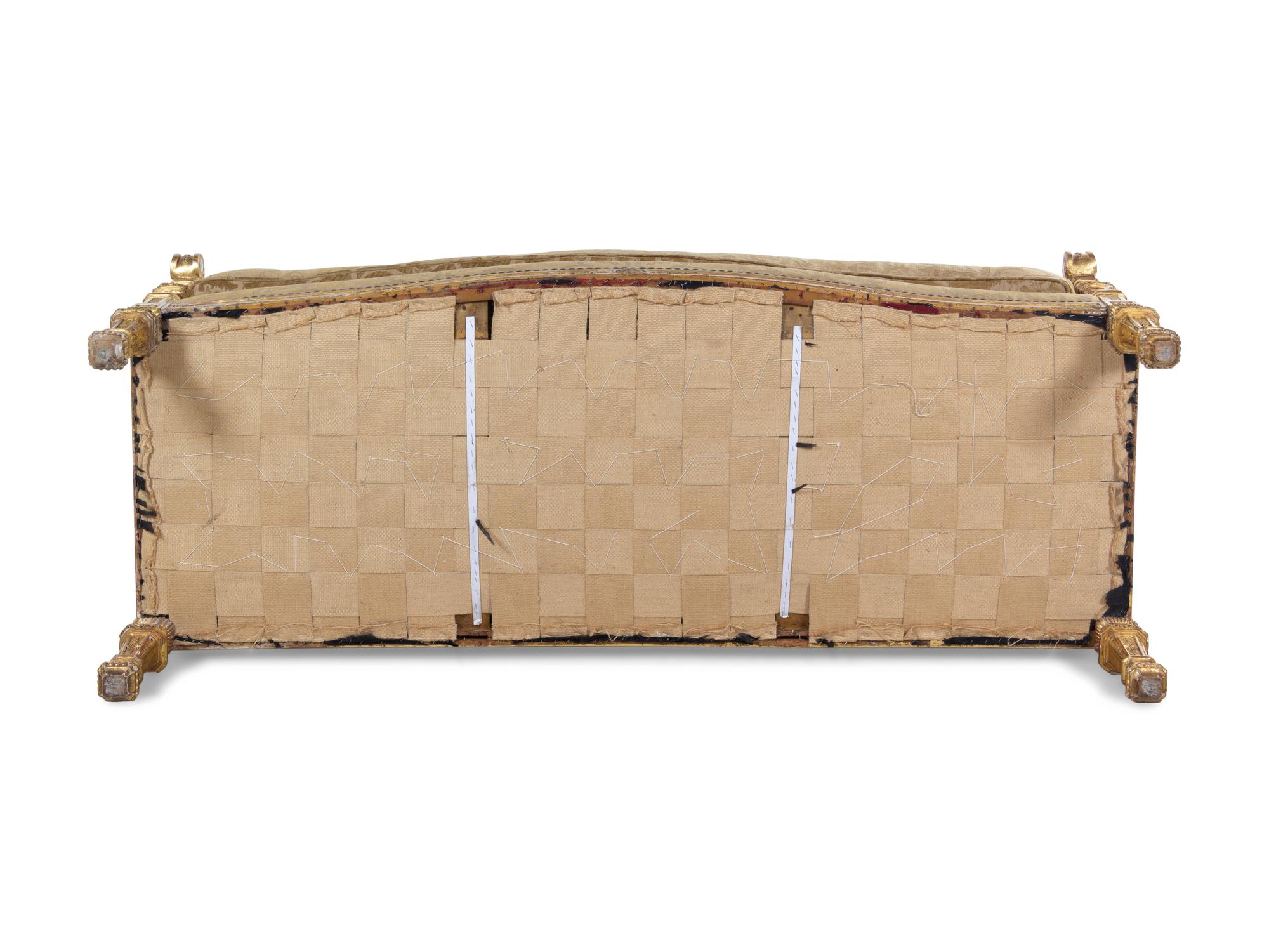 A Pair of Régence Style Carved Giltwood Sofas