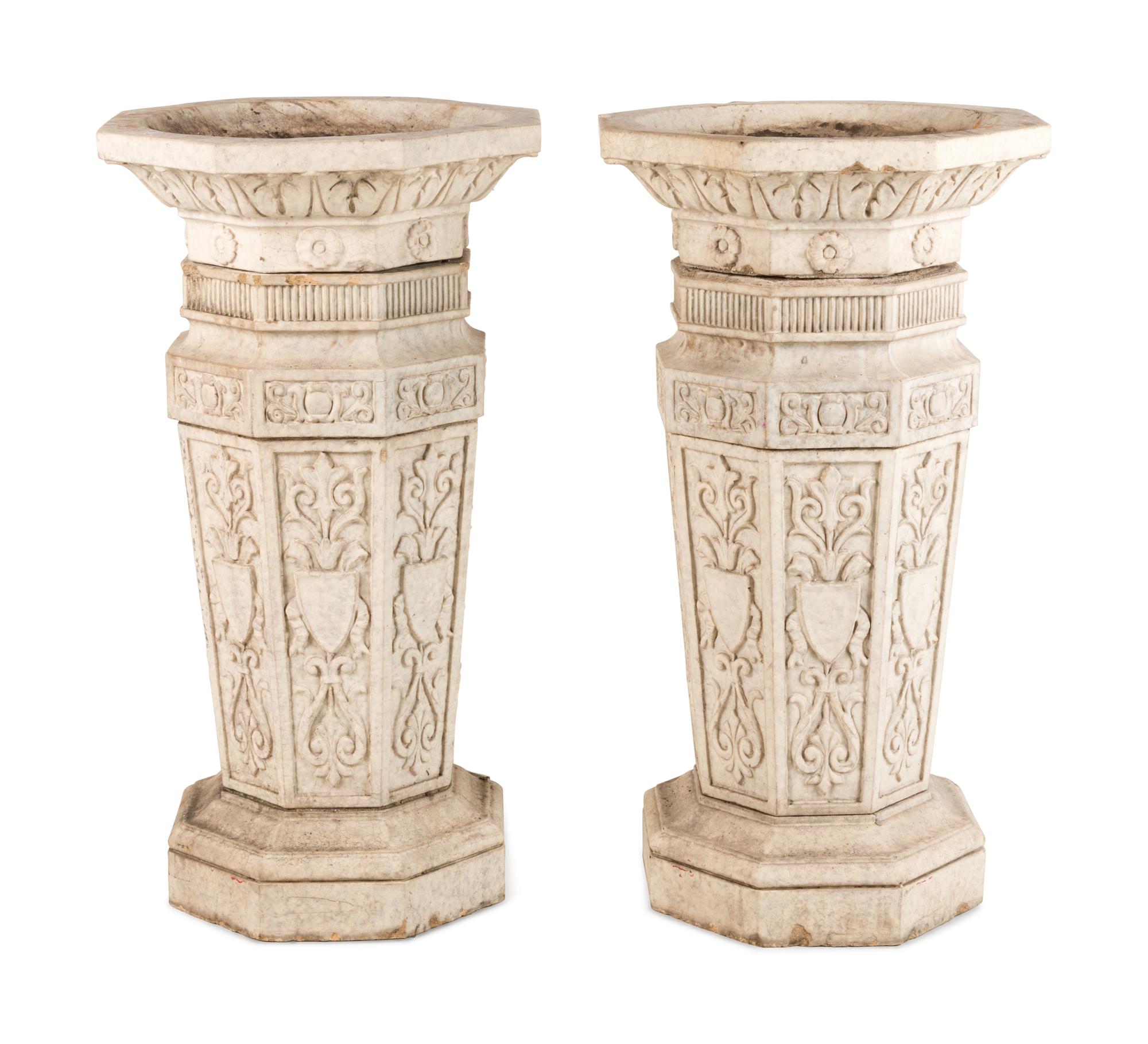 A Pair of Glazed Terra Cotta Urns and Pedestals
