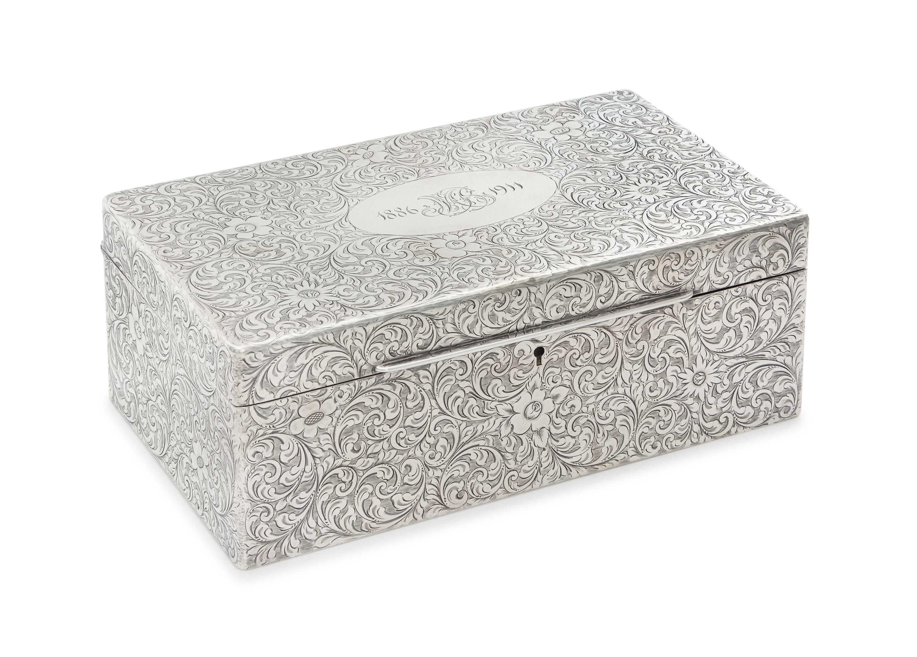 An American Silver Table Casket, Tiffany & Co., New York, NY, Early 20th Century, the hinged rectangular case worked to show allover fl