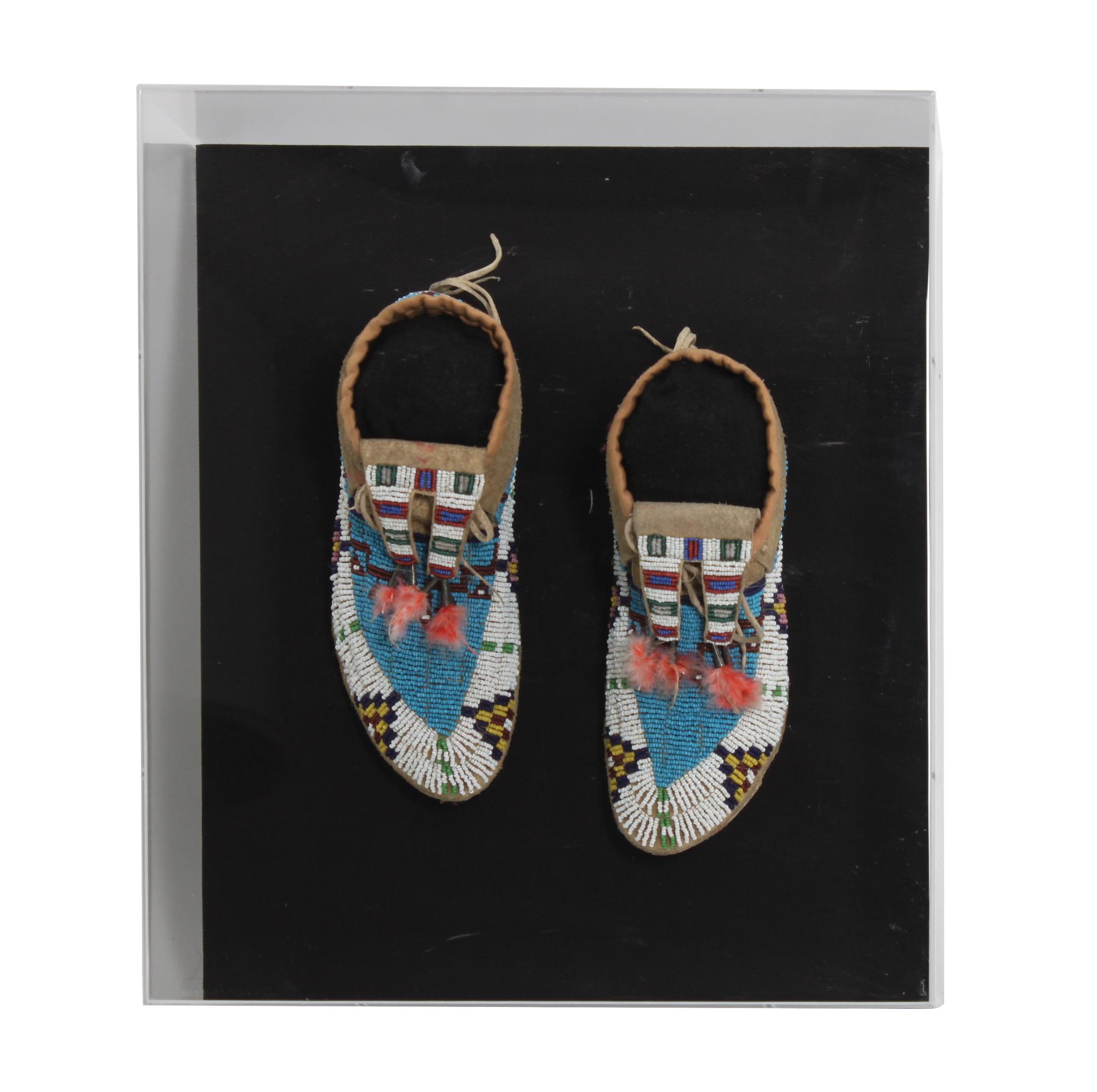 A Pair of Sioux Mocassins Lelngth 8 1/2 inches — CIRCA 1900