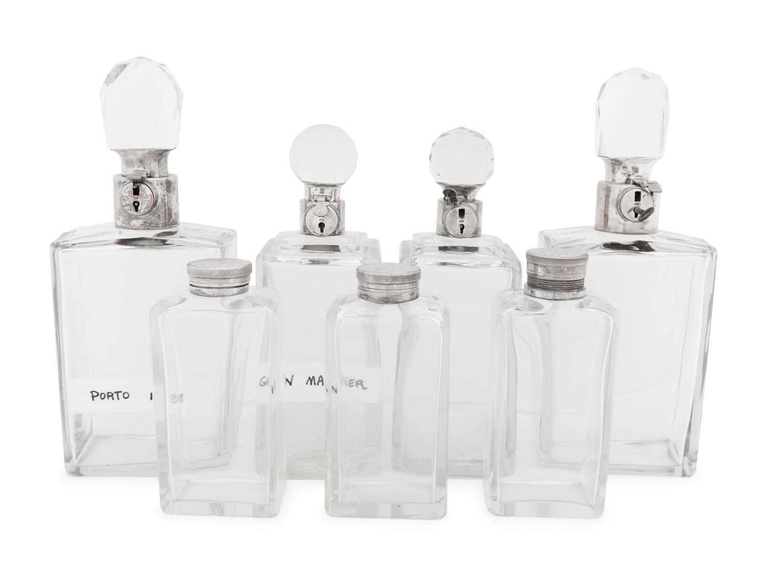 Seven Silver and Silver-Plate Mounted Glass Decanters